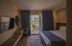 Postel nebo postele na pokoji v ubytování Pyramisa Beach Resort Sahl Hasheesh + 37 fotografií