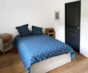 Postel nebo postele na pokoji v ubytování L'Auberge du Ranc