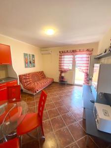 a living room with a couch and a table at Apartments Villa Viktoria in Tivat