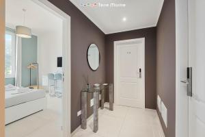 a bathroom with a bed and a mirror at Italian House Cinque Terre, Terre Marine in La Spezia