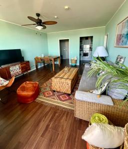 a living room with a couch and a table at Coast House Moana in Bremerhaven