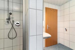 a bathroom with a shower and a sink at Sulzerhof in Bad Rippoldsau-Schapbach +37 photos