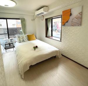 Postel nebo postele na pokoji v ubytování #2 新宿まで2分！清潔で安全な部屋！WIFI無料！