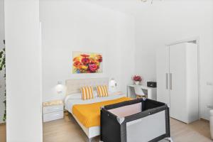 a bedroom with a bed with a tv in it at SORRENTO BEAUTY in Sorrento