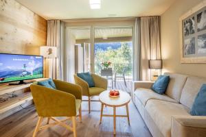 TV a/nebo společenská místnost v ubytování SWISSPEAK Resorts Meiringen