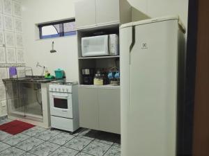 A cozinha ou cozinha compacta de Apartamento aconchegante em Cacoal4