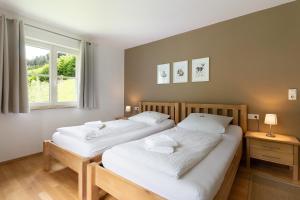 Postel nebo postele na pokoji v ubytování Ferienhaus 1 - Wohnung Tanne, 78qm