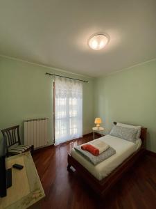 a bedroom with a bed and a window and a couch at Tempio del Sole in Terni +13 photos