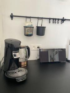 a kitchen counter with a blender and a toaster at Vakantiehuis Zand7 in Lommel