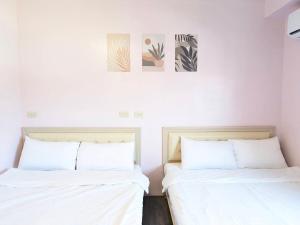 מיטה או מיטות בחדר ב-A-Lang Homestay