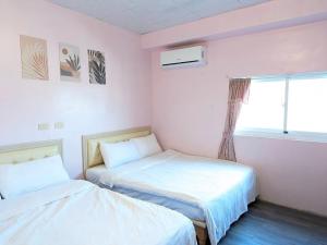 מיטה או מיטות בחדר ב-A-Lang Homestay