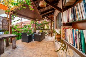 a room with a book shelf filled with books at Yoga House Kaş in Kaş