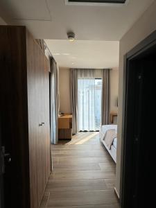 Postel nebo postele na pokoji v ubytování Hotel Utopia