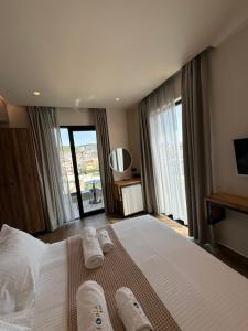 Postel nebo postele na pokoji v ubytování Hotel Utopia