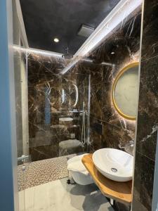 Koupelna v ubytování Hotel Utopia