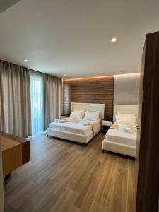 Postel nebo postele na pokoji v ubytování Hotel Utopia