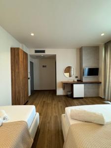 Postel nebo postele na pokoji v ubytování Hotel Utopia