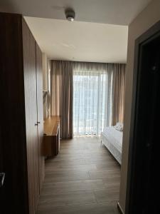 Postel nebo postele na pokoji v ubytování Hotel Utopia