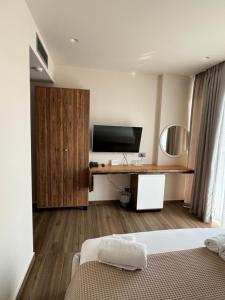 TV a/nebo společenská místnost v ubytování Hotel Utopia