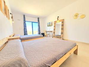 Postel nebo postele na pokoji v ubytování B&B La Nava Suites