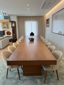a conference room with a wooden table and chairs at PORTO - Penafiel - QUINTA DE SANTIAGO COUNTRY HOUSE in Penafiel +28 photos