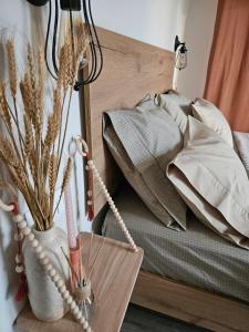 a bedroom with a bed and a vase with flowers at Marivar living in Nea Fokea +18 photos