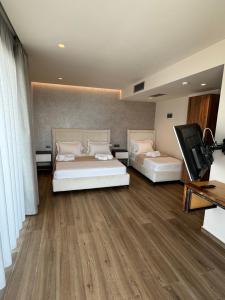 Postel nebo postele na pokoji v ubytování Hotel Utopia