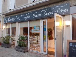 a store with a sign on the front of it at Chez Nanou, à proximité de St Emilion in Sainte-Terre +3 photos
