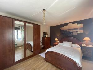 a bedroom with a large bed and a sliding glass door at Finca Robejones VV-511-AS in Colombres