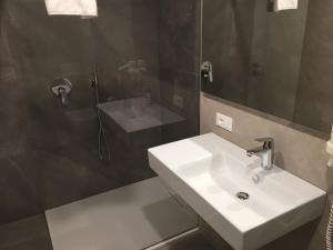 a bathroom with a sink and a shower at Residence Marina in Riva del Garda