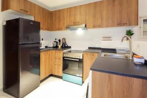 A kitchen or kitchenette at Silk Valley - Furnished 1bhk With Pool And Gym
