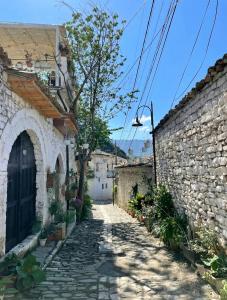 a cobblestone alley in an old stone building at Hotel Gorica - UNESCO quarter in Berat