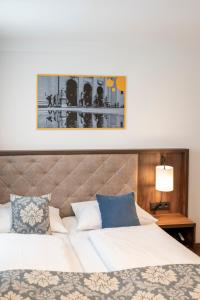 Postel nebo postele na pokoji v ubytování Salzburg Hotel Lilienhof