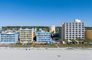 a view of a city from the beach with buildings at Beach Club at Montego Inn in Myrtle Beach
