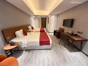 Postel nebo postele na pokoji v ubytování Hotel Omni Residency Baridhara