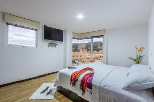 Postel nebo postele na pokoji v ubytování Gaviota Apartments & Suites