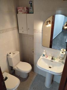 a bathroom with a toilet and a sink at ushuaia in Castellón de la Plana