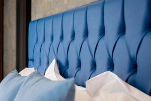 A bed or beds in a room at THE OSiRiS