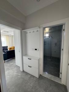 a bathroom with a walk in closet and a shower at The Dalaman Suites & Pansiyon in Dalaman