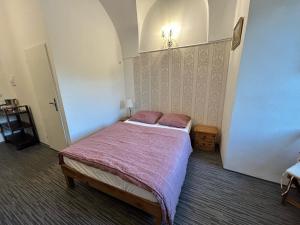 Postel nebo postele na pokoji v ubytování Rezidence Napoleon