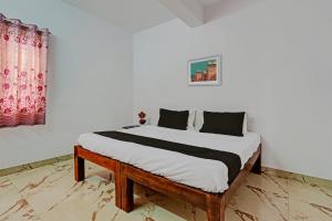Postel nebo postele na pokoji v ubytování OYO Suparna Boarding And Lodging Hotel And Restaurant