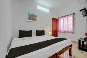 Postel nebo postele na pokoji v ubytování OYO Suparna Boarding And Lodging Hotel And Restaurant