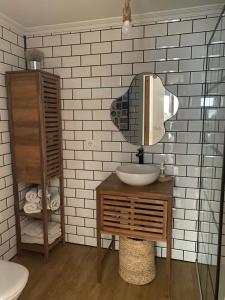 a bathroom with a sink and a mirror at Rincón de Beluso, Bueu in Pontevedra