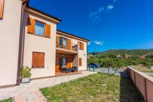 a villa with a view of the yard at Family house with swimming pool in Novi Vinodolski