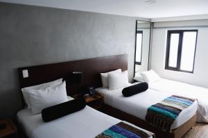 Postel nebo postele na pokoji v ubytování Hotel DC Feria