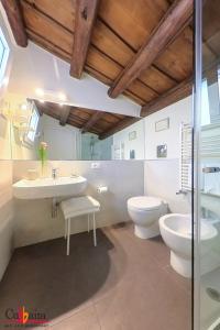 a bathroom with a sink and a toilet and a shower at B&B Cubbaita in Palermo