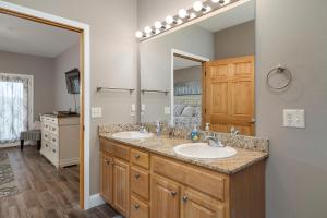 a bathroom with two sinks and a large mirror at Condo #353 in Branson +20 photos