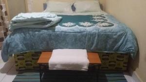 En eller flere senge i et værelse på RusticHome B&B, Kigali + 11 billeder