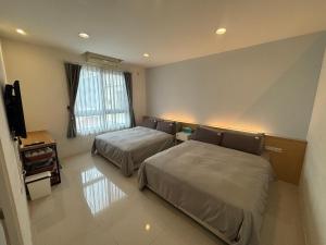 Letto o letti in una camera di 充電樁 羅東雲朵朵Cloud B&B免費洗衣機 烘衣機 近週三清溝 星巴克咖啡豆 國旅卡特約店