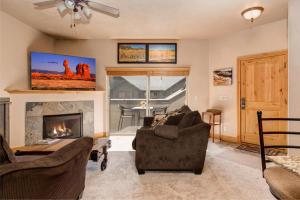 a living room with a couch and a fireplace at Foxpoint 1684-H3 by Moose Management in Park City +48 photos